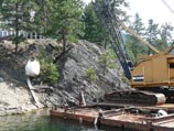 Crane delivering material over the lake