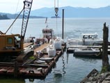 Off loading bags of material from the barge via crane
