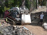 Forklift shuttling material back to the work site