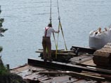 Moving material via crane from the barge
