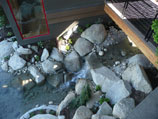 Water feature meandering under a bridge
