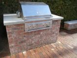 Custom red brick BBQ with concrete cap