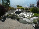 Stone firepit, flagstone, and paver patio
