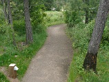 Clay, crushed, aggregate path wandering off into the wilderness