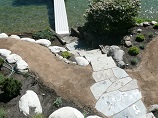 Flat stone steps down to water