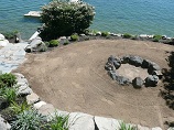 Rock ringed firepit overlooking lake