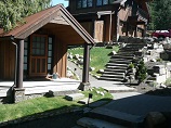 Pathway with stone steps and pavers running by out buildings