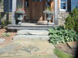 Entrance walkway with fitted rock