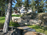 Cut stone pathway with multiple layers of retaining wall