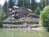 Multiple large boulder retaining walls for stability