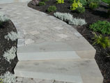 Paver walkway with single piece steps