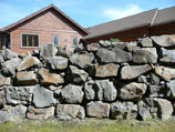 Drystacked rock retaining wall
