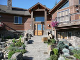 Natural stone steps with landscaped approach and boulder accents