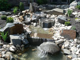 Tiered waterfall collection ponds with natural bird bath