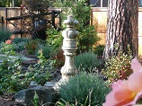Concrete decoration in flower beds surrounded by flowers