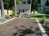 Paver patio parking space just past gate
