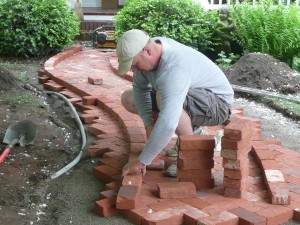 Lay out pavers to create the desired border lines.