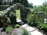 Self-supported rock arch garden entry