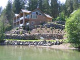 Lake cabin with multiple tiers of basalt retaining walls