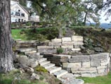 Multi-tiered retaining wall using rectangular 'Stutzke Stone' from Clark Fork