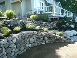 Natural rock dual tier retaining wall