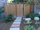 Slab walkway and custom cedar fence