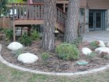 Edging, boulders and lawn in the back yard
