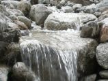 Natural boulder waterfall made from river stone