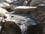 Stone bridge crossing stream bed