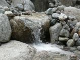 Closer view of a splash pool waterfall water feature
