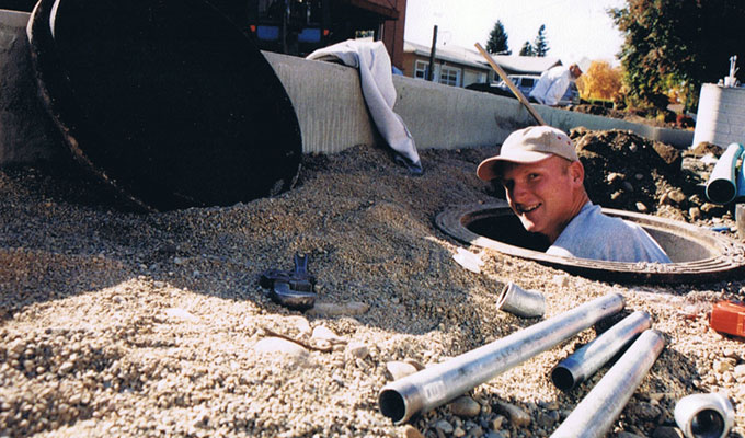 Owner Nate Lynch working in a drywell Owner Nate Lynch working in a drywell