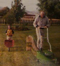 Nate finding his way around the back yard with a wheelbarrow