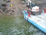 Offloading excavation equipment from the barge