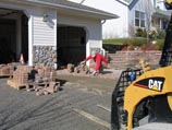 Nate Lynch installing pavers for a stone paver driveway
